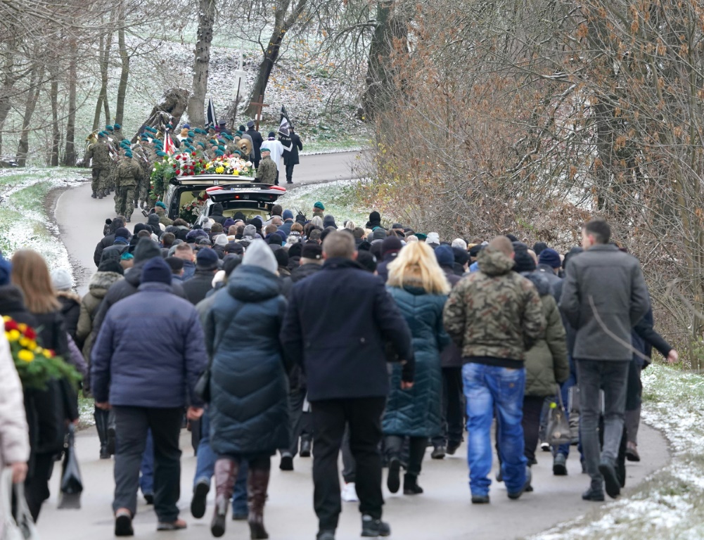 Mourners attend the funeral on Saturday of one of two victims of a missile that hit a southeastern Polish village near the border with Ukraine, in Przewodow