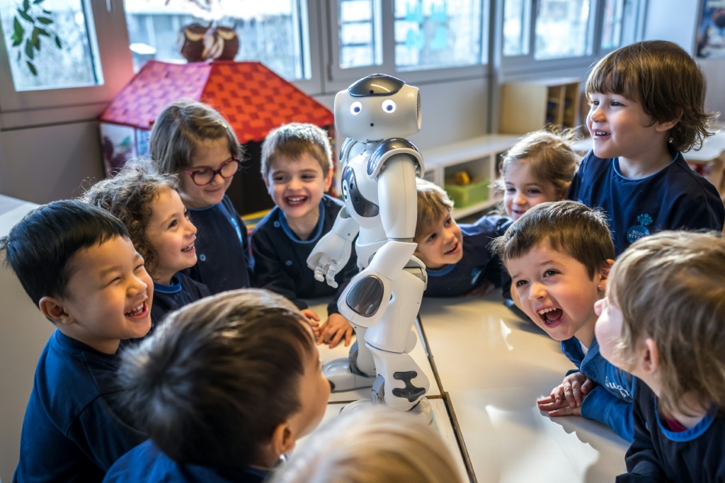 Nao, nao... Swiss children in a Lausanne creche have some fun with their new robot friend, Nao