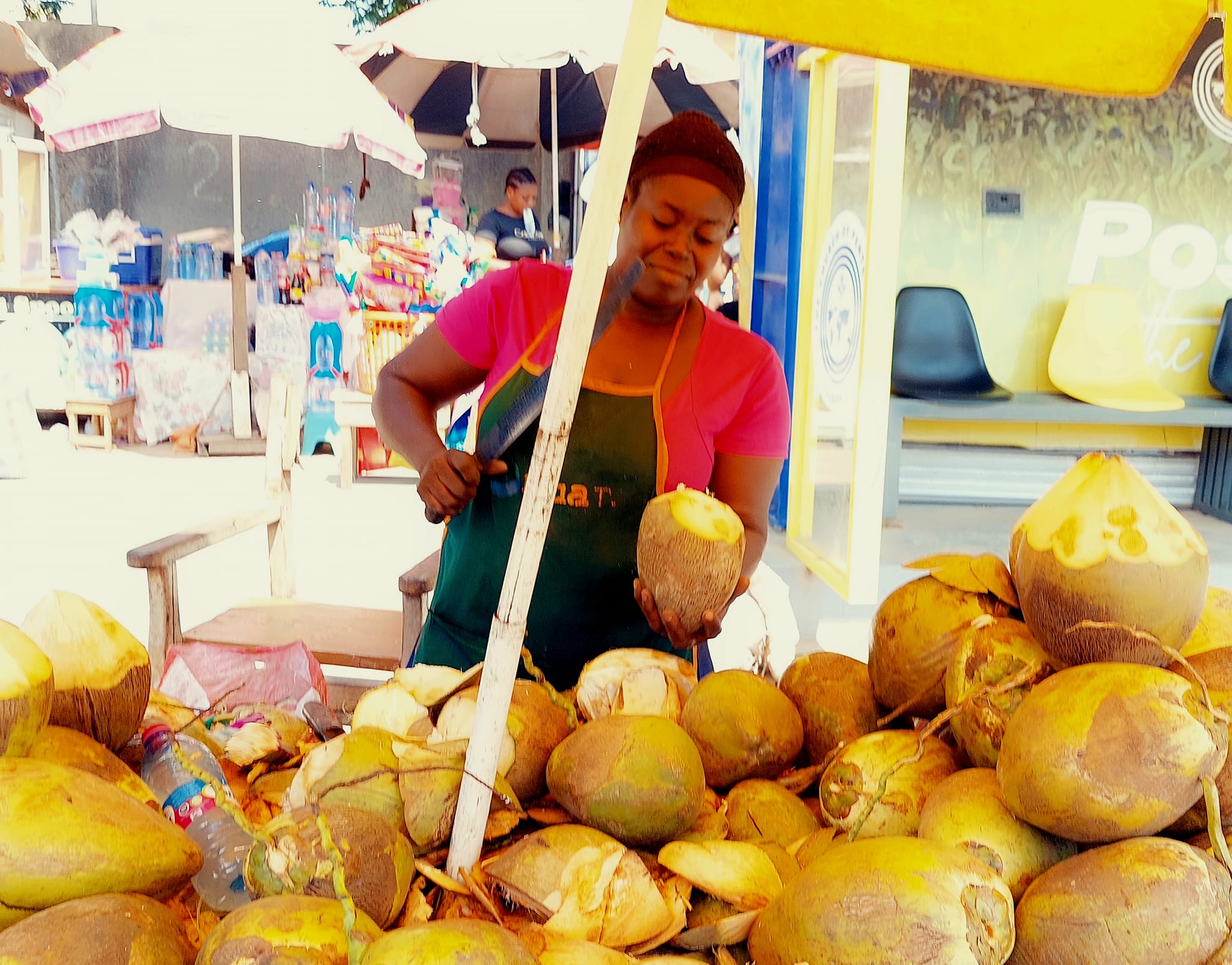 Photo of Enyonam the female coconut vendor.