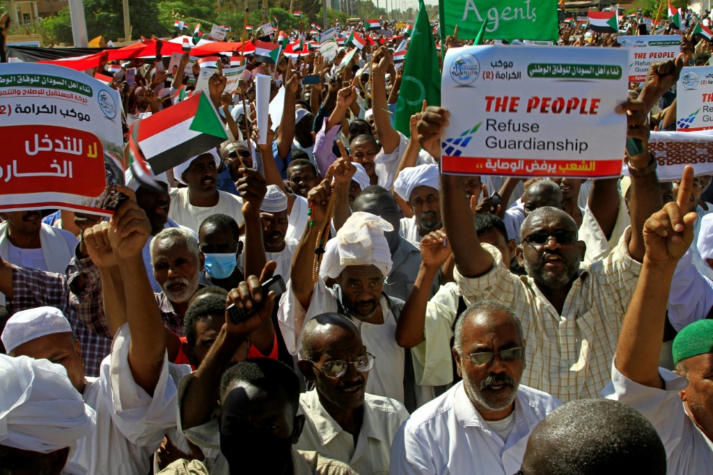 Sudanese protest against the United Nations mediation between Sudan's civilian and army leaders, outside the UN headquarters in the Manshiya district of the capital Khartoum