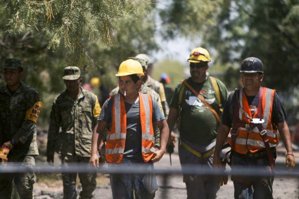 Mexican soldiers and rescue personnel work at a coal mine in northern Mexico where 10 workers have been trapped for a week