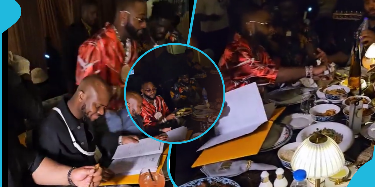 Davido sits at dinner table with King Promise, refuses to eat food served him