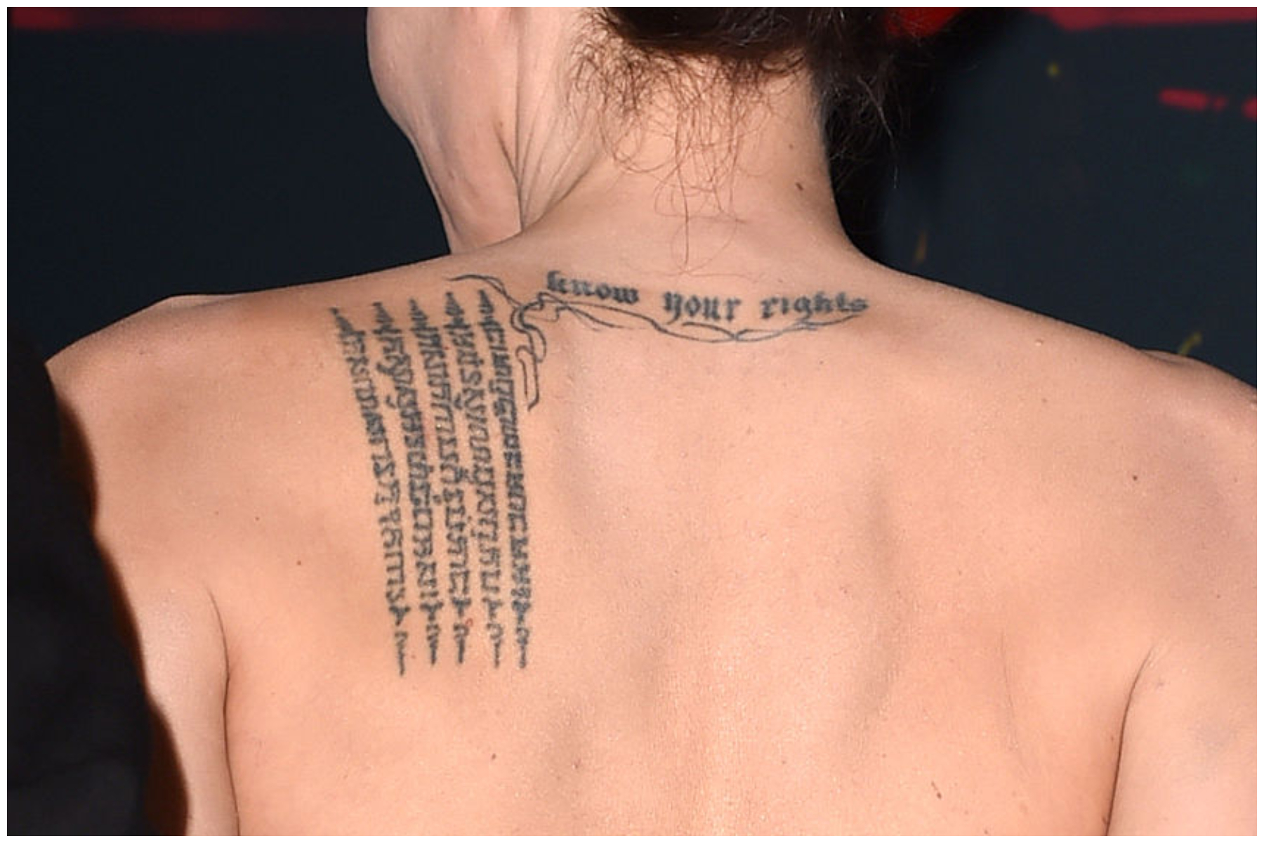 Angelina Jolie's Buddhist Pali tattoo on her upper left back at the 18th Annual Hollywood Film Awards at the Hollywood Palladium