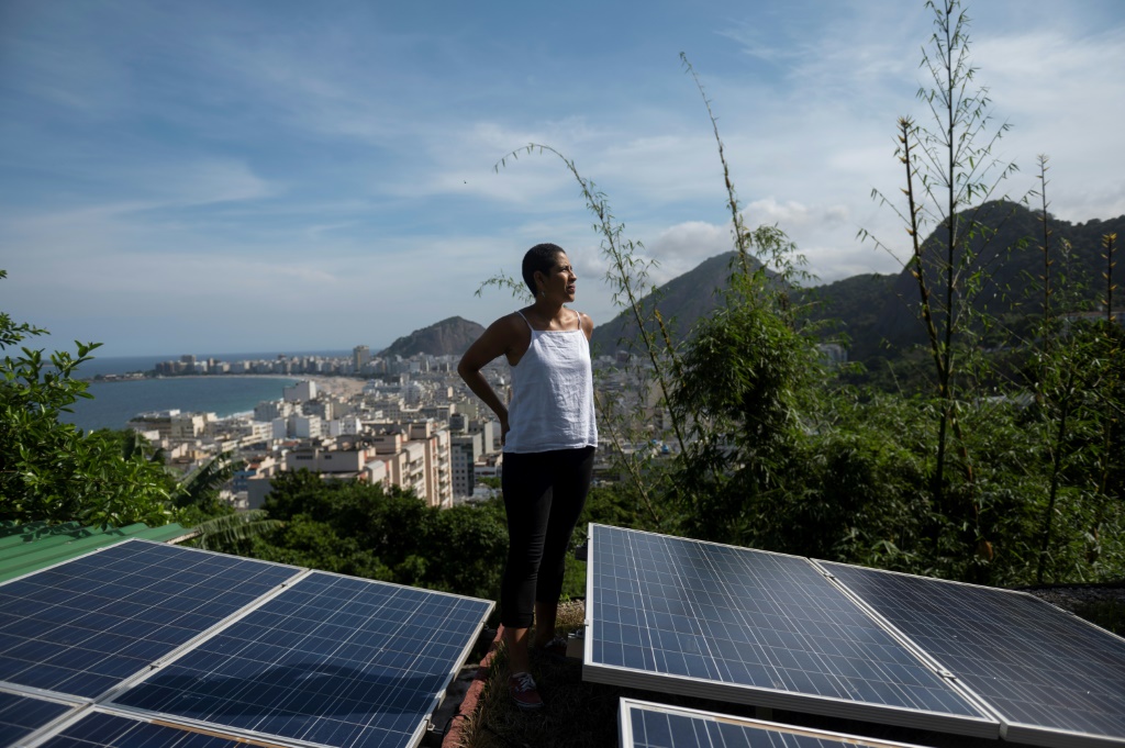 Bibiana Angel has covered the roof of the hostel she owns in a Rio de Janeiro favela with solar panels