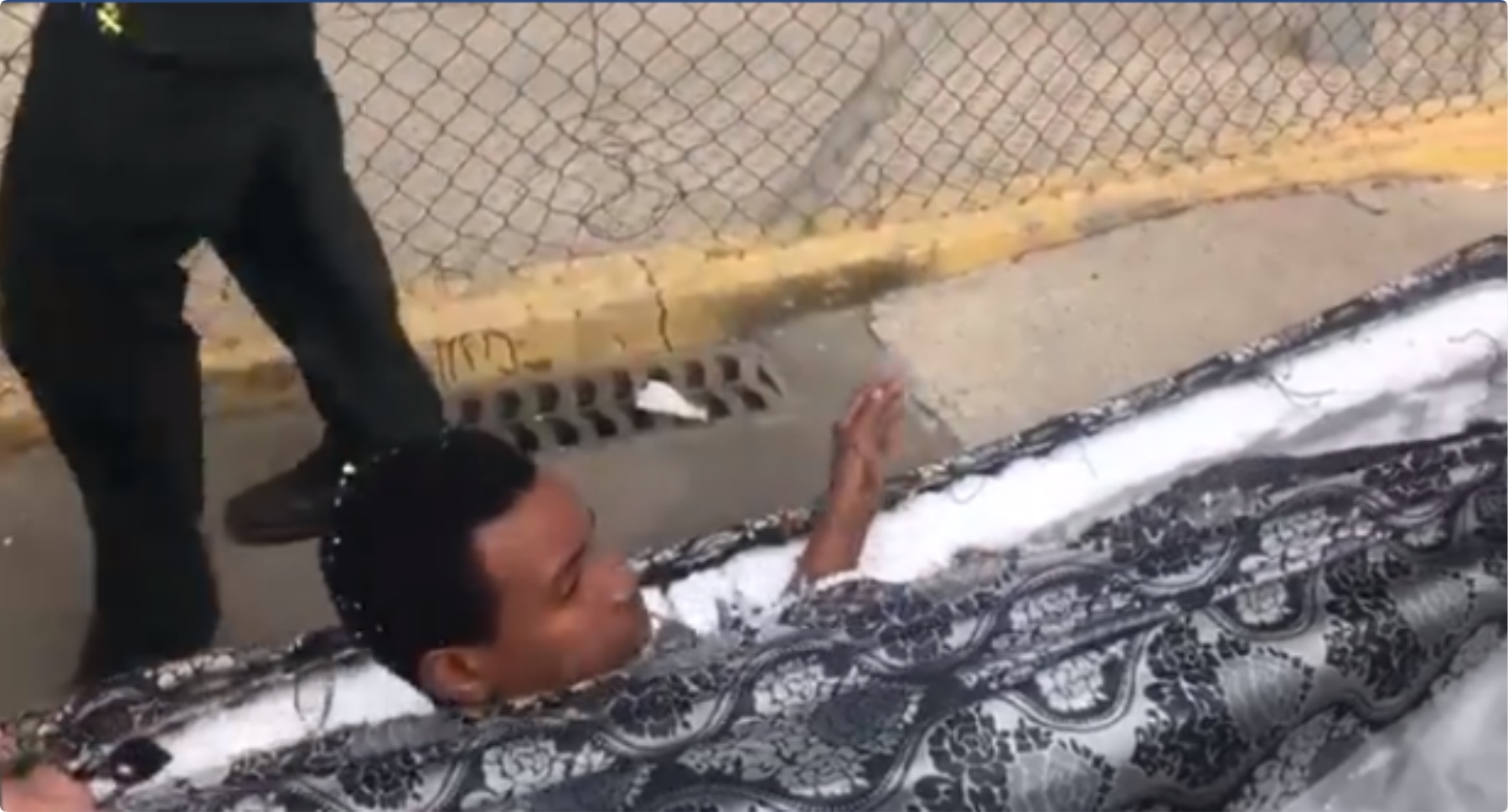 Video of two African migrants caught hiding in mattress pop up
