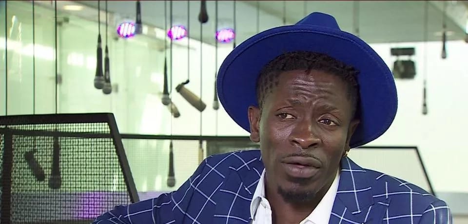 Shatta Wale in blue hat and jacket