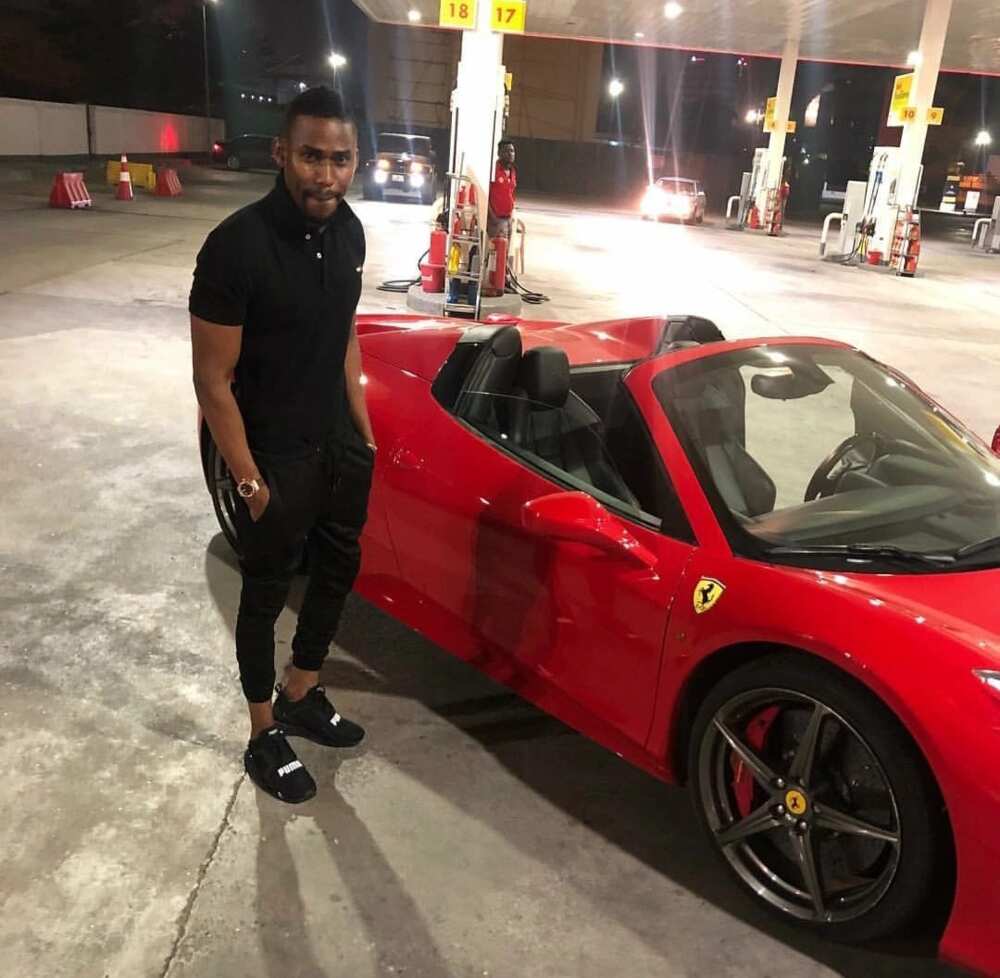 Ibrah by one of his many luxurious cars