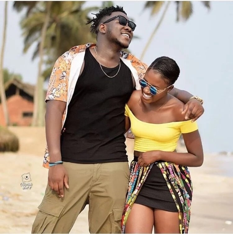 Medikal and Fella Makafui laughing together on a beach
