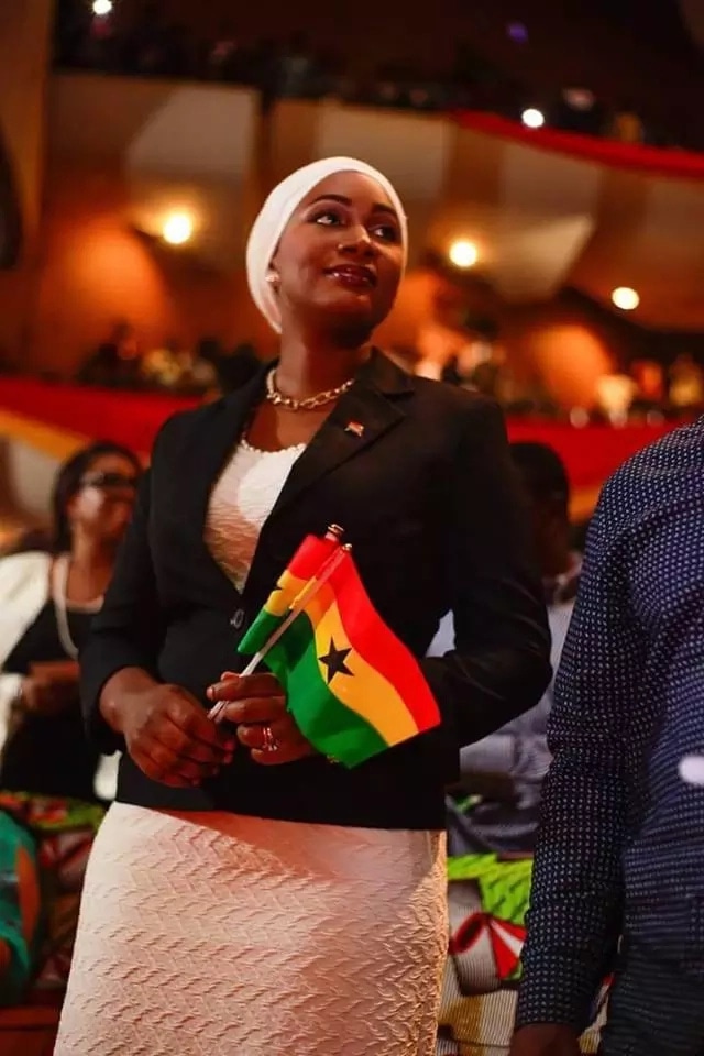 Samira Bawumia holding flags of Ghana
