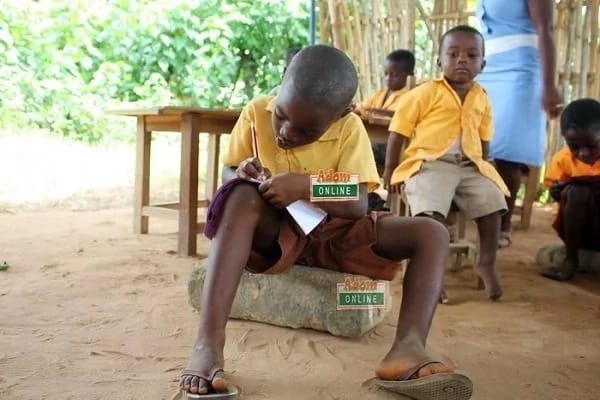 Tapa Amanya school children sit on stones for lessons in Volta Region