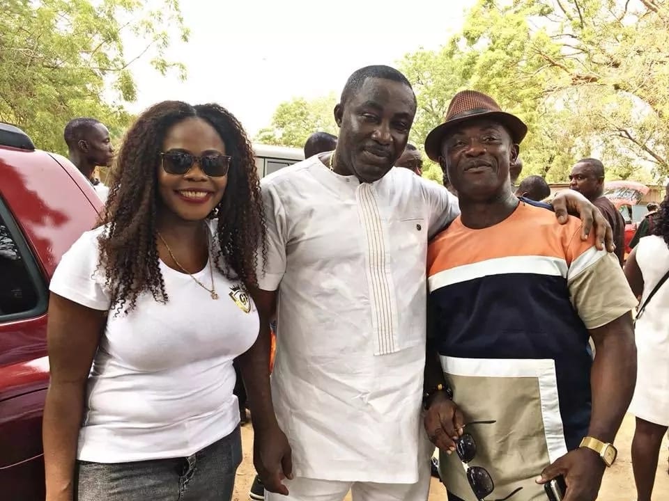 Osei Kwame Despite poses with a man and a woman