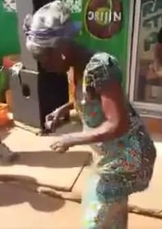 Old lady in her 80s dances like a young girl on streets of Accra