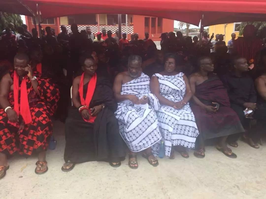 Mourners seated at a memorial service