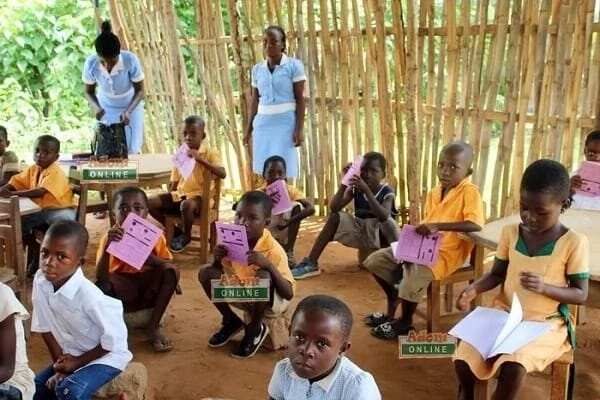 Tapa Amanya school children sit on stones for lessons in Volta Region