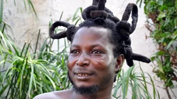 King Ayisoba in his stylish hairdo, is a known Kologo traditional musician