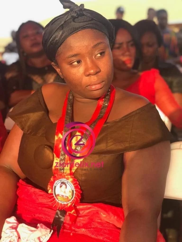 Maame Serwaa in funeral clothing and wears a sad look on her face