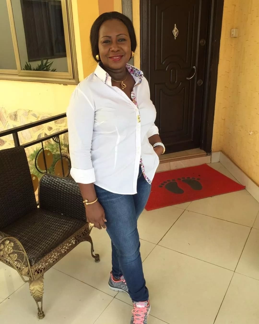 Gifty Anti wearing a white shirt and jeans