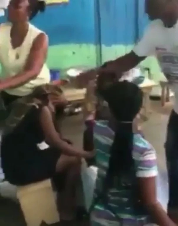 SAD VIDEO: Ghanaian men BRUTALLY beat two women accused of lesbianism in Berekum
