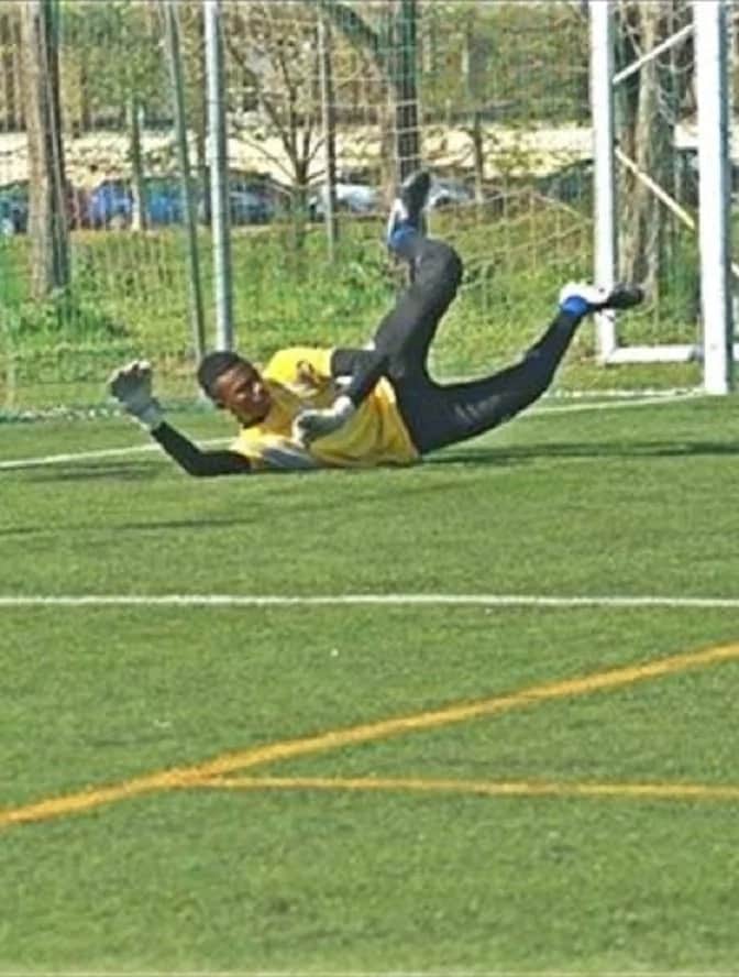 A goalkeeper lying on the ground