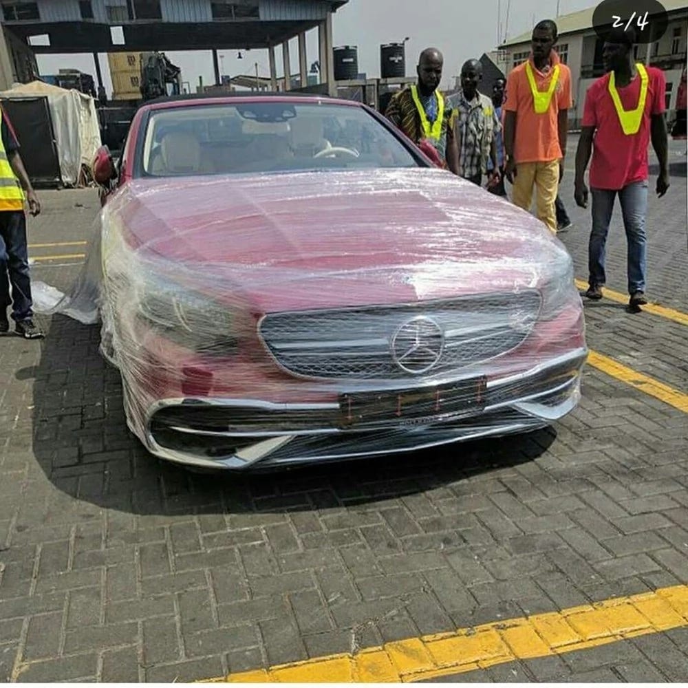 Harbour officials looking at a Mercedes Maybach S650