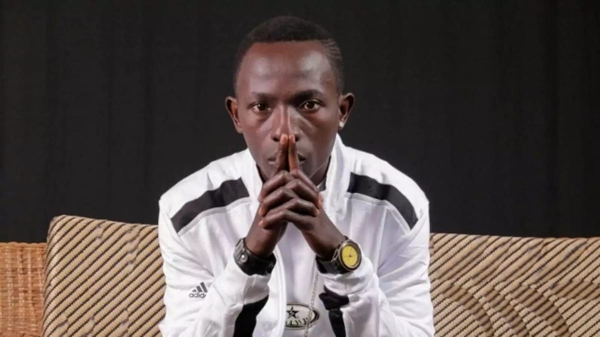 Patapaa seated in a chair