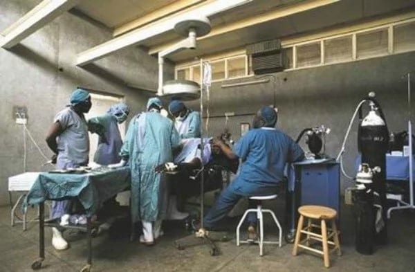 Doctors at work in an operating theatre