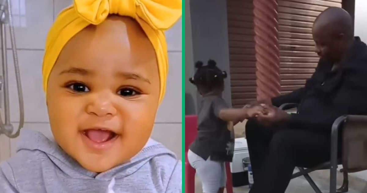 A toddler chilling with her grandfather in a TikTok video