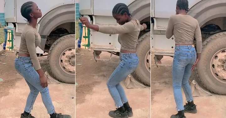 Female truck driver dances on the road