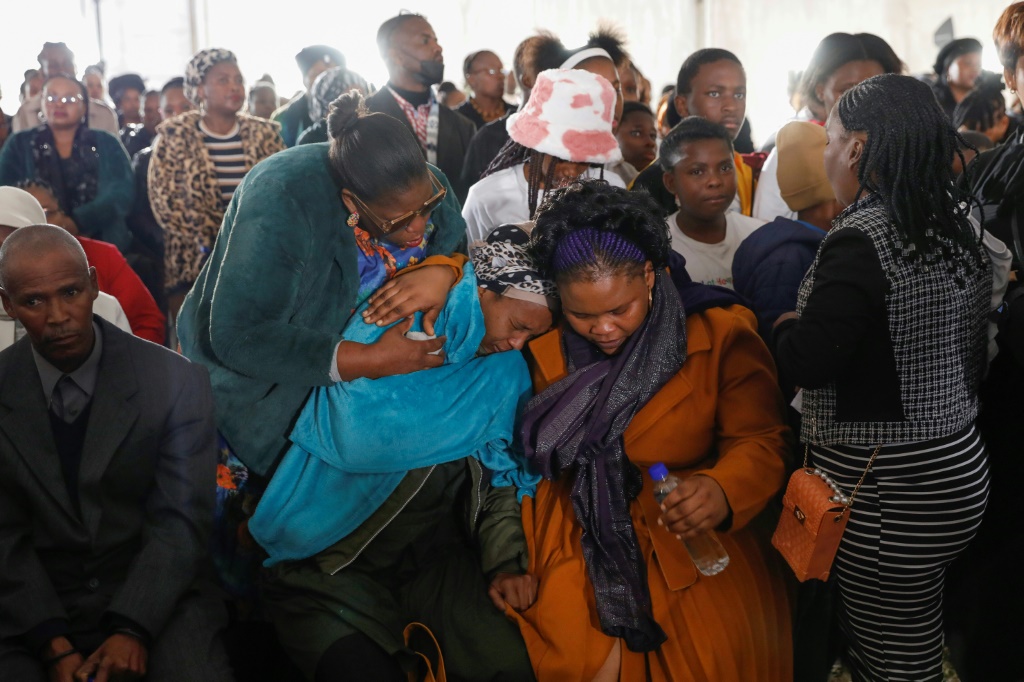 Grief: The tragedy has left families numbed and demanding answers