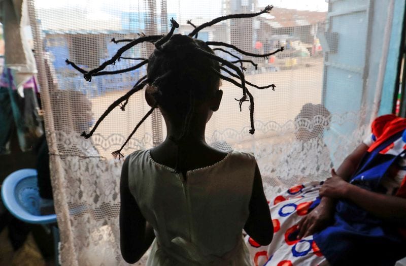 Nairobi hairdressers invent new spiky style resembling coronavirus to create awareness