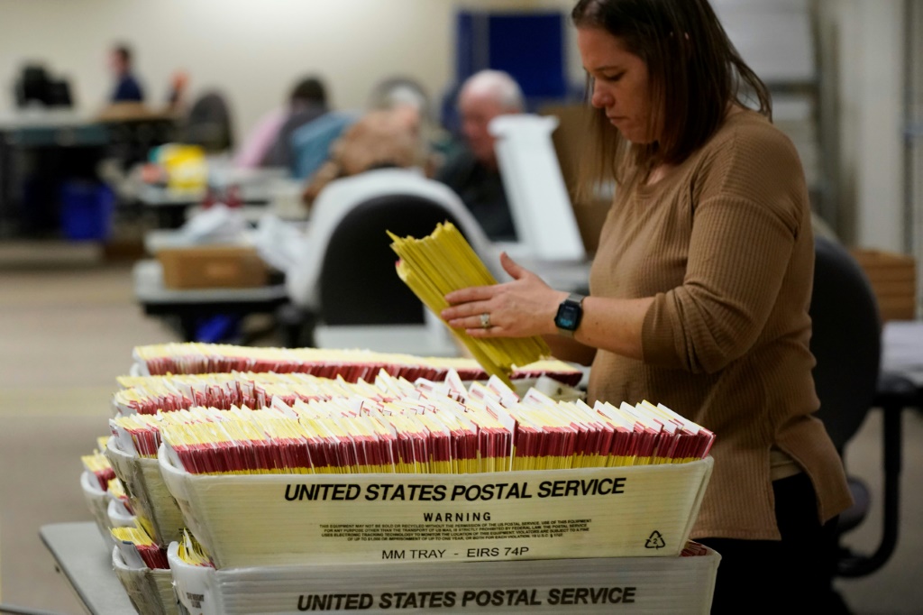 Mail-in ballots are processed and authenticated in Salt Lake City, Utah on November 7, 2022