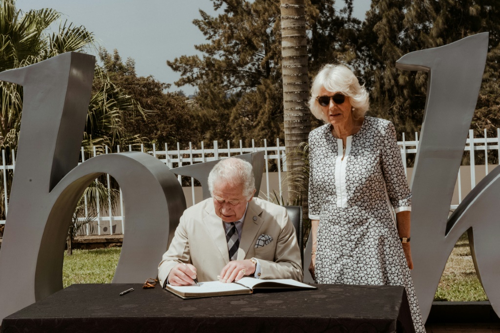 Britain's Prince Charles, accompanied by his wife Camilla, signed a note of remembrance at the Kigali Genocide Memorial