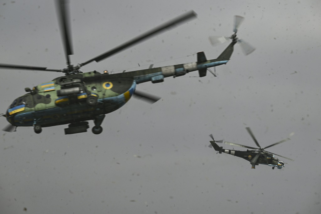 Ukrainian pilots say their ancient Mi-24s (R) and Mi-8s (L) are outplayed technologically by Russia