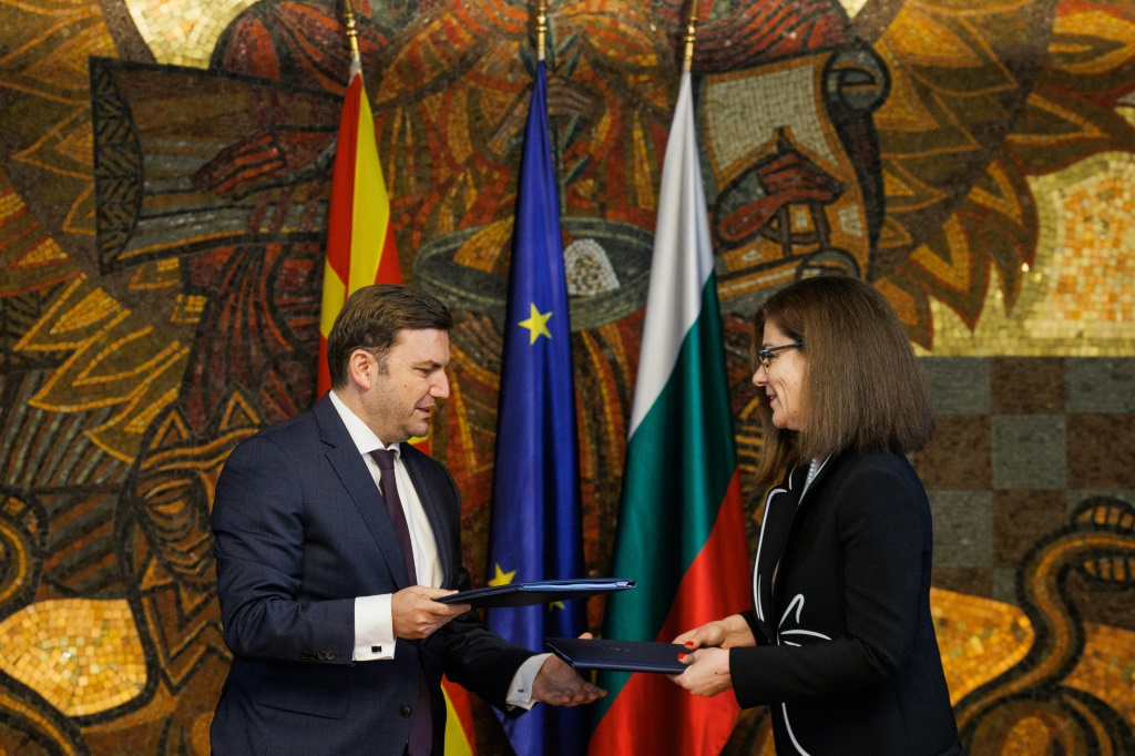 Bulgarian Foreign Minister Teodora Genchovska and her North Macedonian counterpart Bujar Osmani exchange a signed deal in Sofia