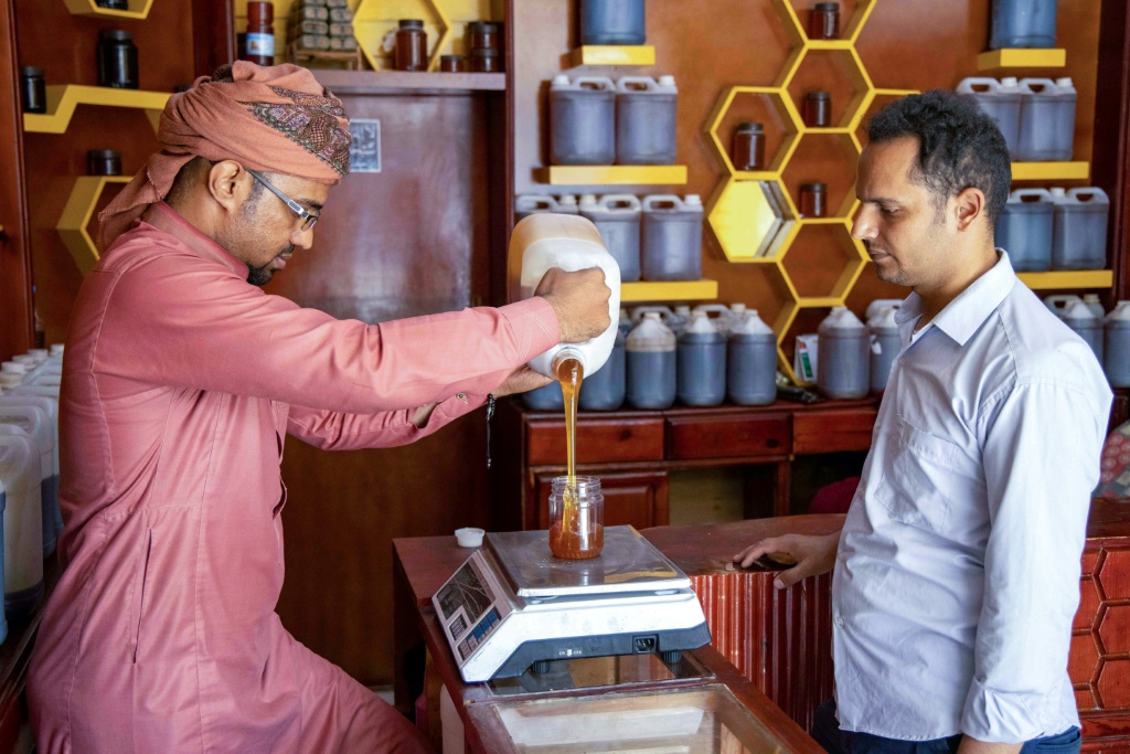 Shopkeepers in Yemen's third city Taez say they made a good living selling honey before the war but now few customers can afford it