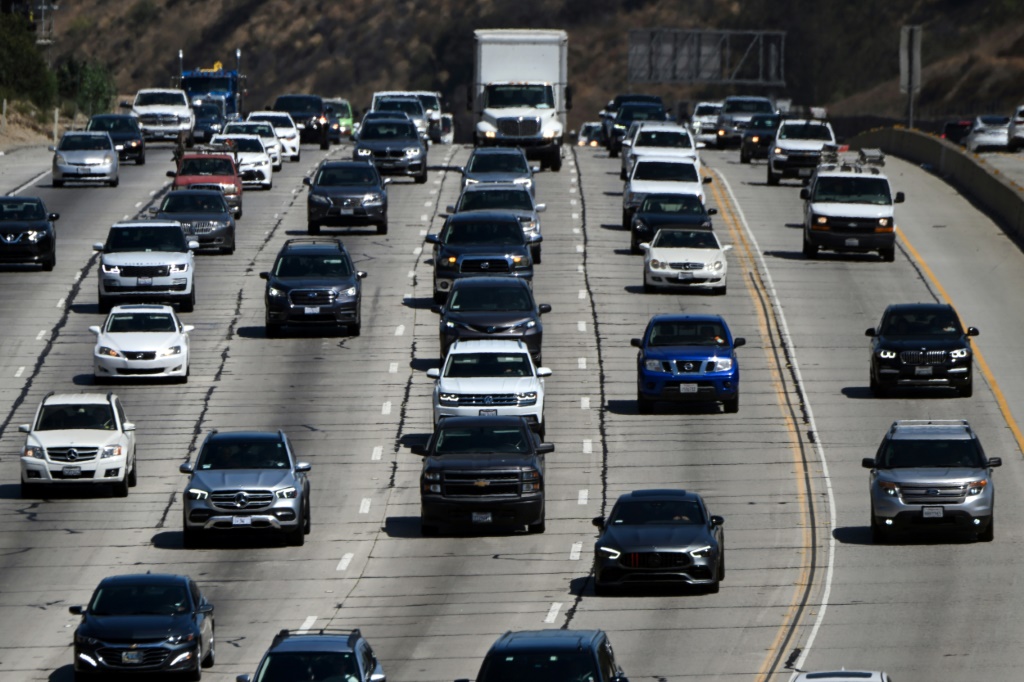 Cars, trucks, SUVs, and other vehicles drive in traffic on the 405 freeway through the Sepulveda Pass in Santa Monica, California, on August 25, 2022