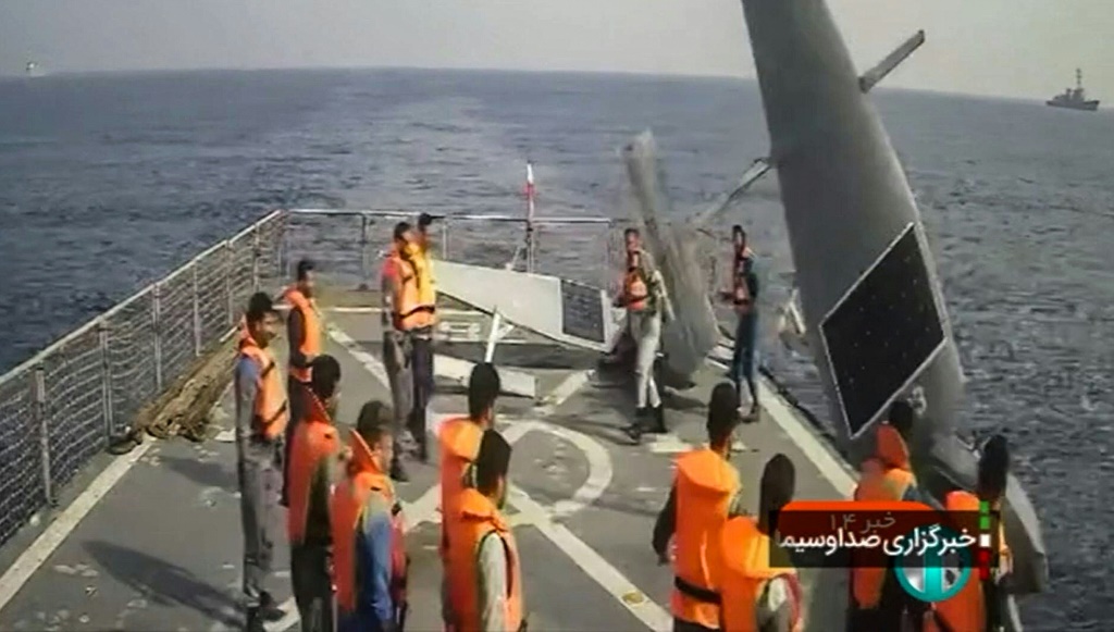 Iranian sailors aboard a destroyer with two US Navy Saildrone unmanned surveillance vessels in the Red Sea. The Iranians gave them back to the US Navy.