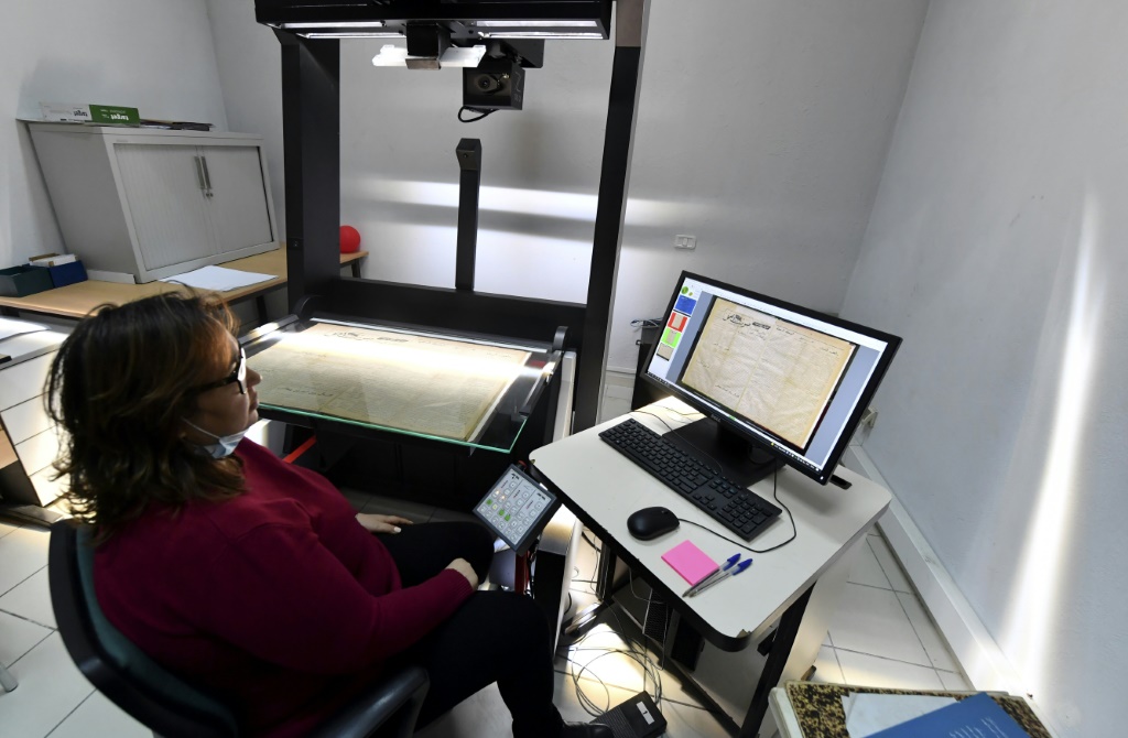An employee at the National Library of Tunisia consults scanned documents