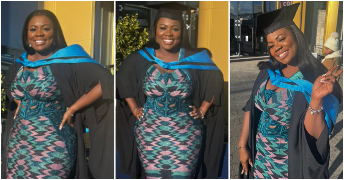 Black woman graduates with her master's degree.