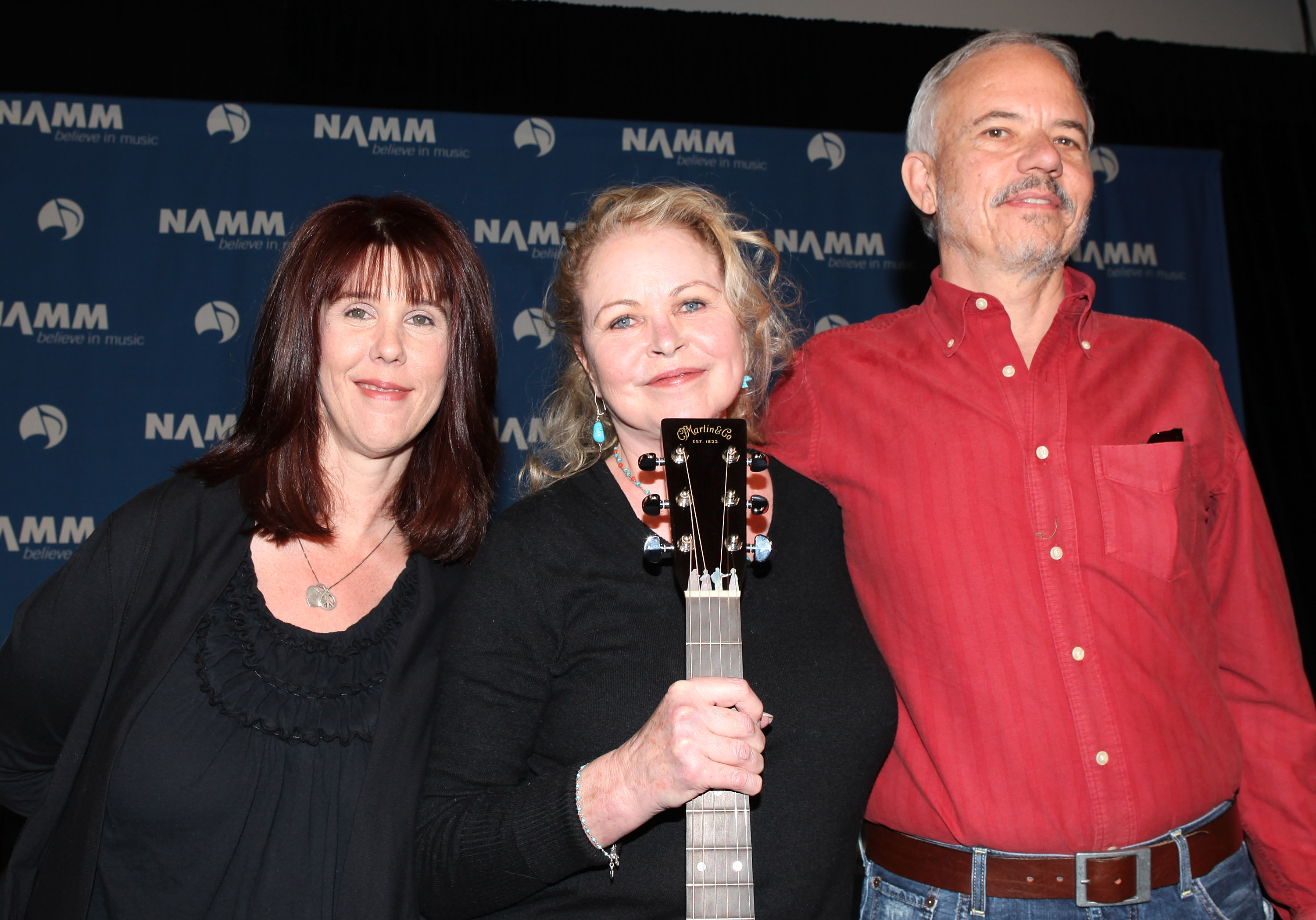 From (L-R) Mama Cass Elliot's daughter Owen Elliot-Kugell, musical icon Michelle Phillips and John Phillips' son Jeffrey Phillips pose at the Anaheim Convention Center
