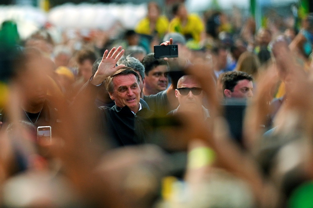 Brazil's President Jair Bolsonaro (C) still has "every chance" to win re-election in October 2022, despite trailing in pre-election polls, according to political analyst Leandro Gabiati