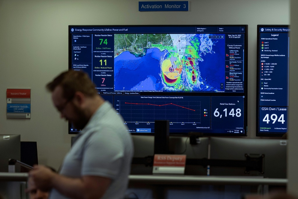 Employees monitor Hurricane Ian inside the National Response Coordination Center at the Federal Emergency Management Agency (FEMA) headquarters in Washington