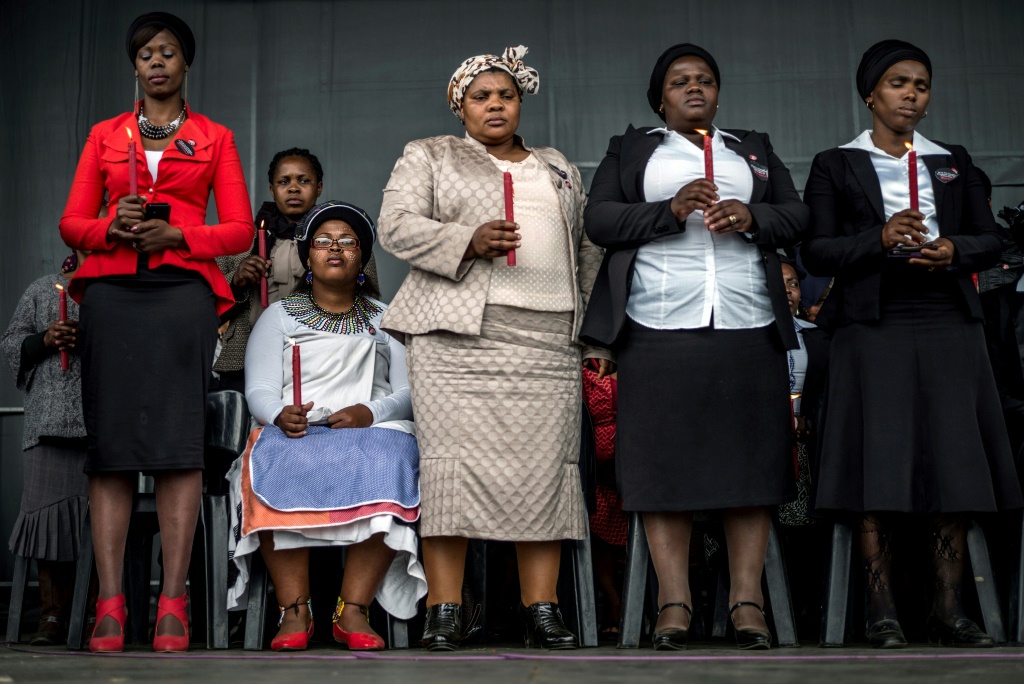 Bereaved family members at a memorial service, two years after the shootings in Marikana