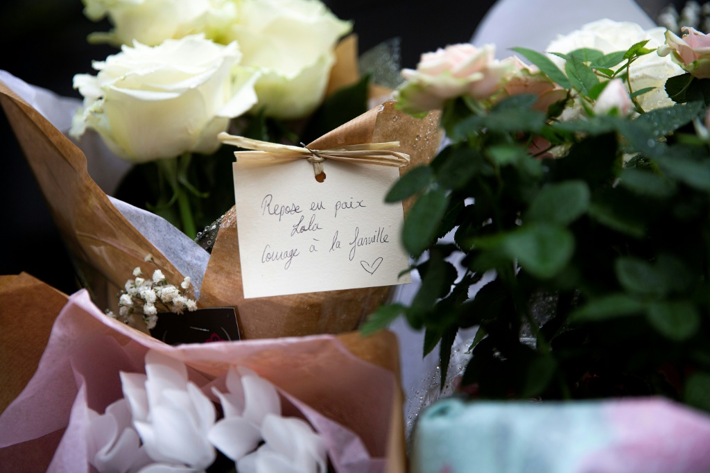 Locals left flowers with a hand-written message which read 'Rest in peace Lola, courage for the family', outside the building where the 12-year-old disappeared