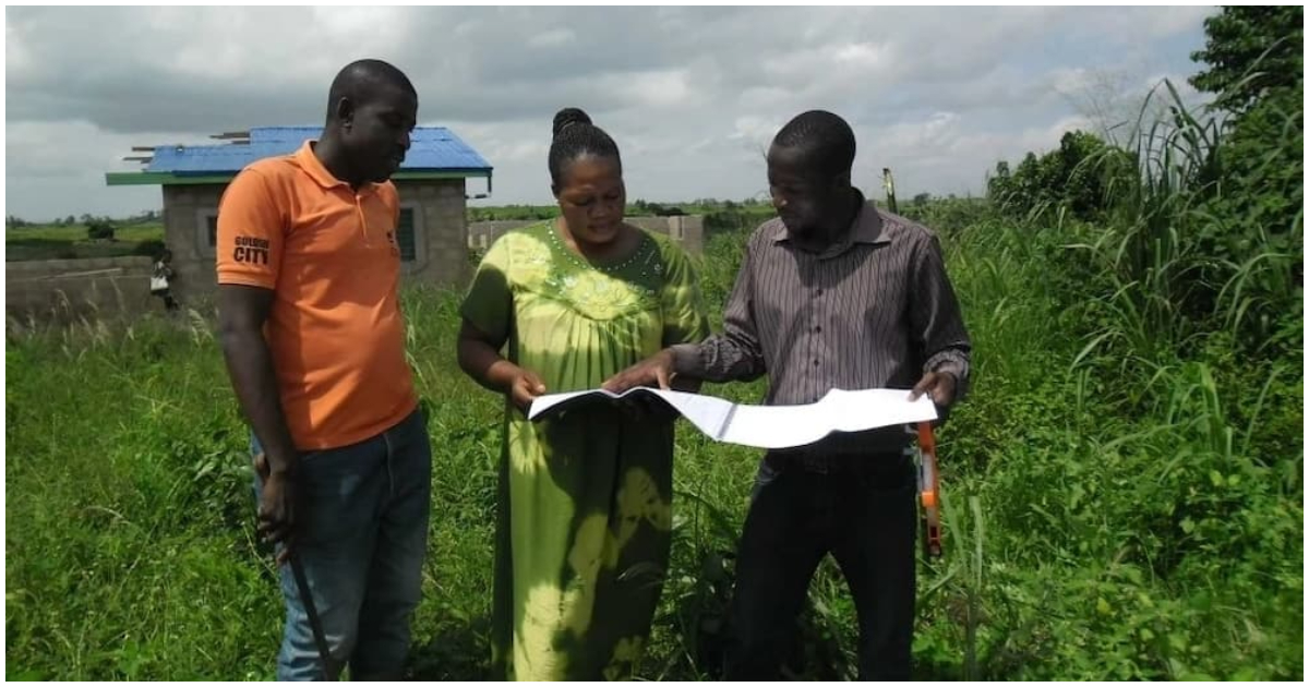 People inspecting a plot of land