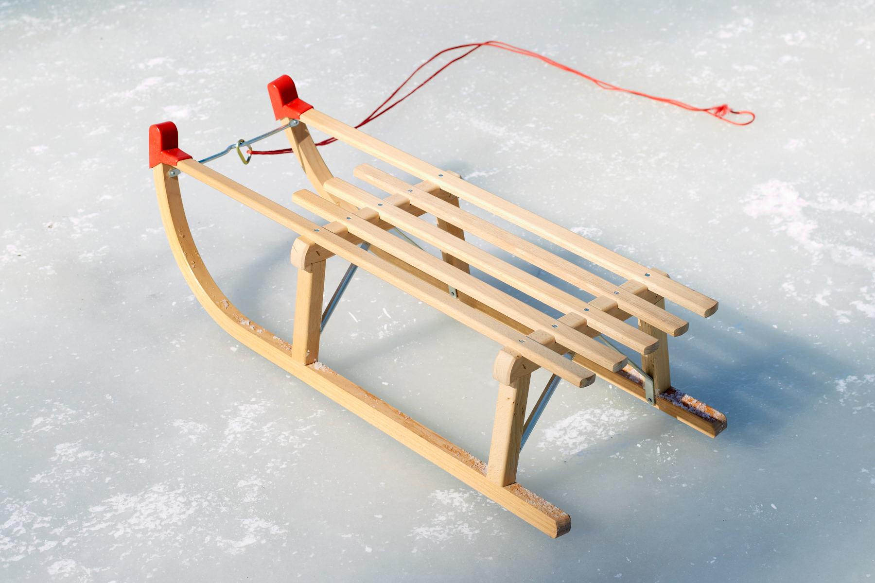 A wooden sledge on the ground