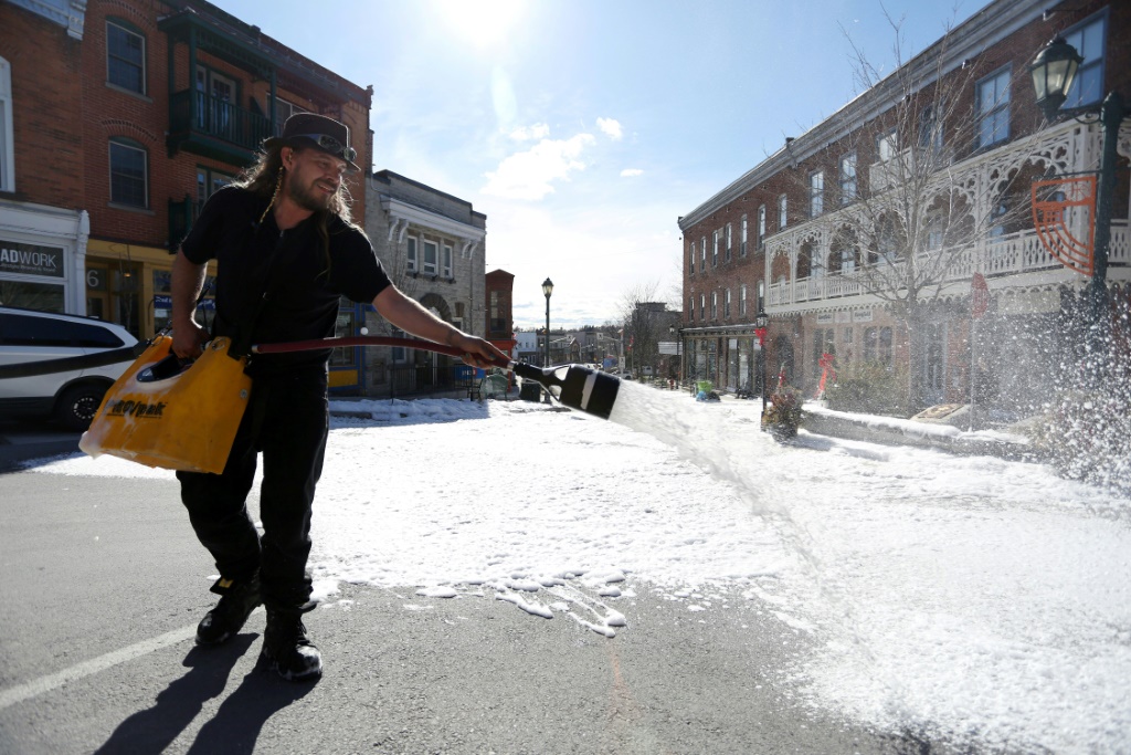 Special effects supervisor Mathieu Bissonnette-Bigras sprays foam to create a winter snow scene -- in April