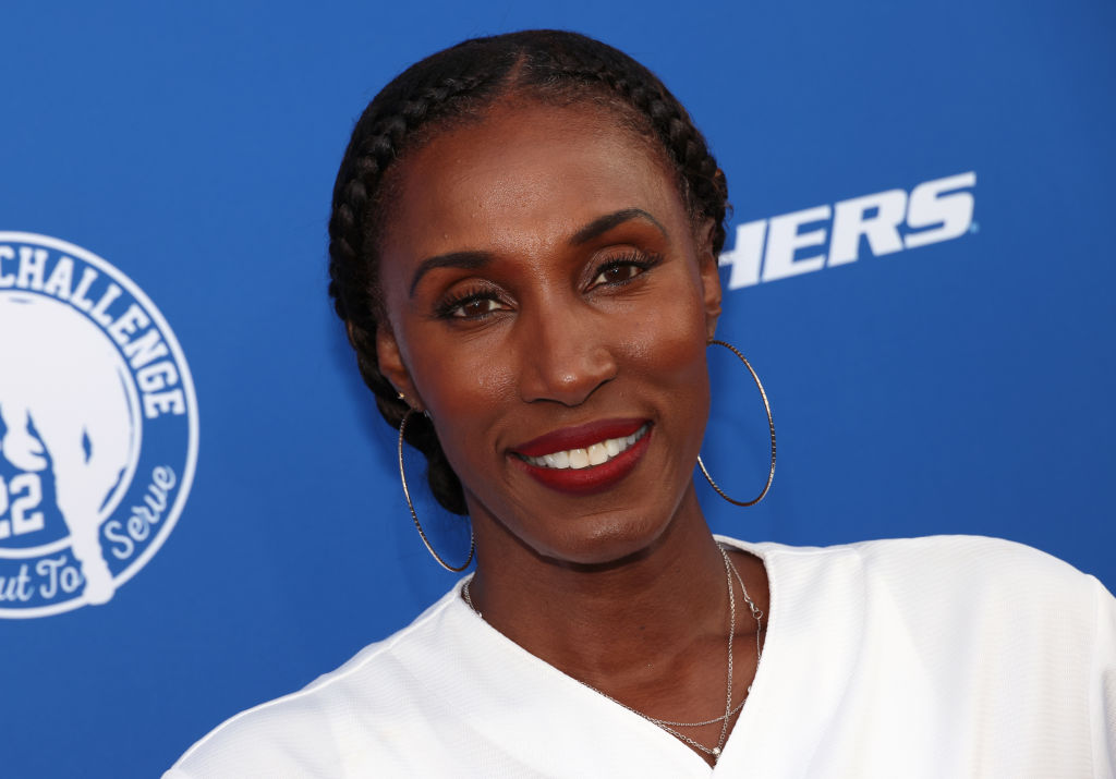 Lisa Leslie in a white blouse and silver jewellery