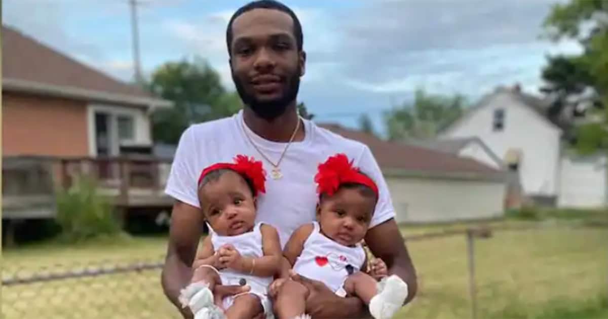 Ray Lucas with his twin daughters.