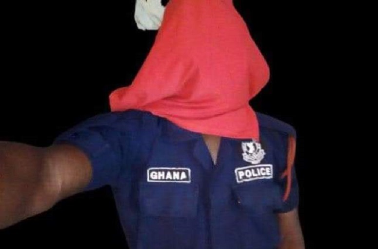 A police officer with a covered face